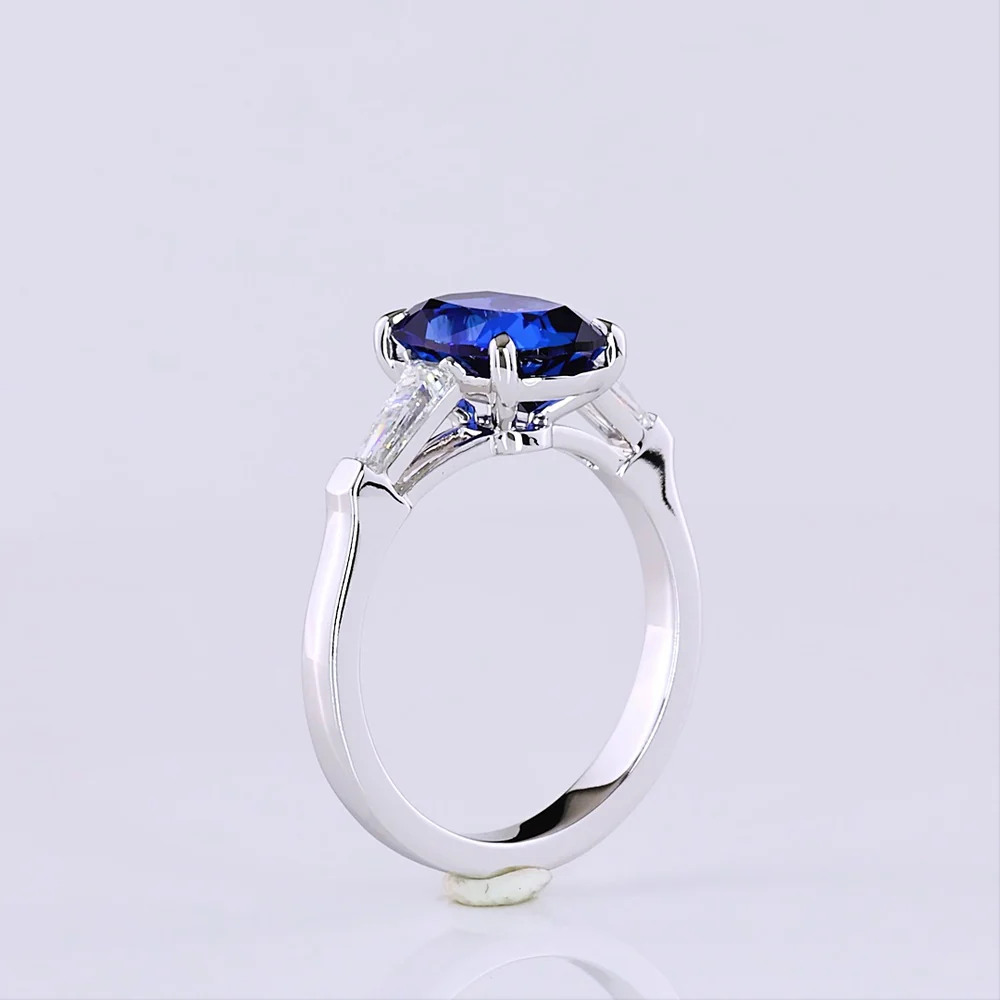 14K White Gold 3-Stone Ring with Cushion Brilliant Cut Lab-Grown Blue Sapphire and Tapered Baguette Diamonds - 3.72 Carat Total Gem Weight - Covaloro Fine Jewelry - Image 4