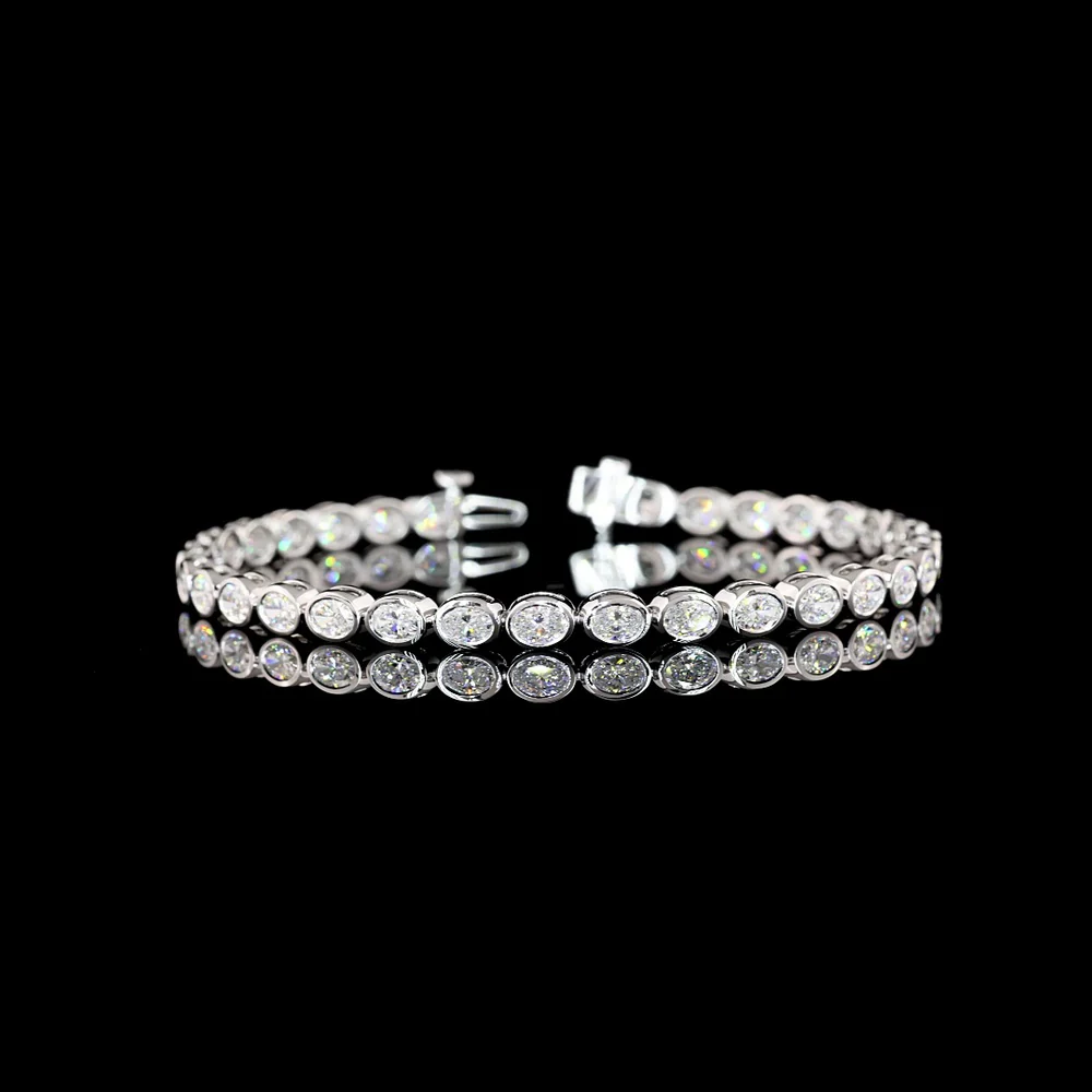 14K White Gold 7.25" Tennis Bracelet with East-West Bezel Set Oval Cut Lab Diamonds - 5.27 Carat Total Weight, F VS1 - Covaloro Fine Jewelry