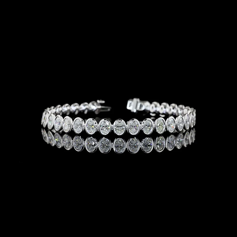14K White Gold 7.5" Tennis Bracelet with 34 Bezel Set Oval Cut Lab Diamonds - 10.74 Carat Total Weight with E-F Color and VS1 Clarity - Covaloro Fine Jewelry
