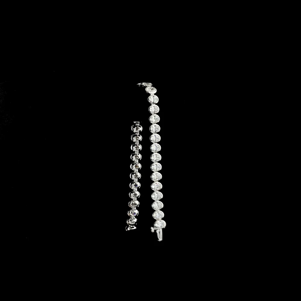 14K White Gold 7.5" Tennis Bracelet with 34 Bezel Set Oval Cut Lab Diamonds - 10.74 Carat Total Weight with E-F Color and VS1 Clarity - Covaloro Fine Jewelry - Image 3