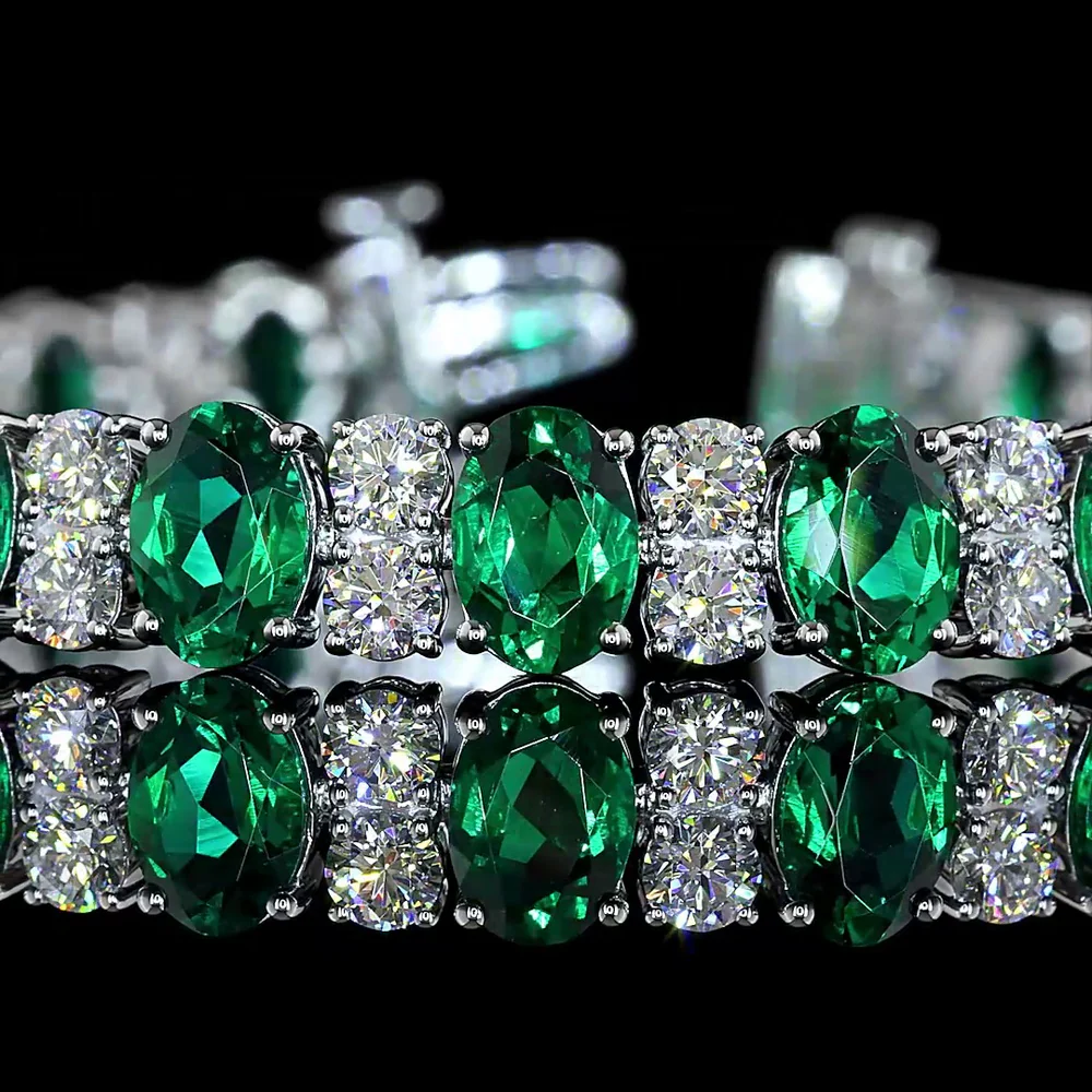14K White Gold 7-Inch Tennis Bracelet with Prong-Set Oval Lab-Grown Green Emeralds - 4.74 Carat Total Weight - Covaloro Fine Jewelry - Image 2