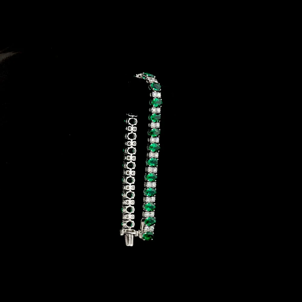 14K White Gold 7-Inch Tennis Bracelet with Prong-Set Oval Lab-Grown Green Emeralds - 4.74 Carat Total Weight - Covaloro Fine Jewelry - Image 3