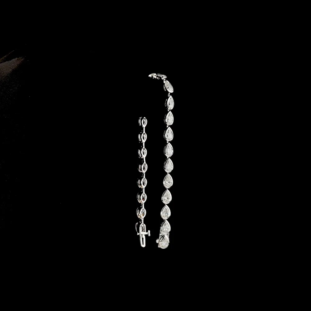 14K White Gold East-West Pear Shape Tennis Bracelet with Bezel Set Lab Diamonds - 7.65 Carat Total Weight (E-F Color, VS Clarity) - Covaloro Fine Jewelry - Image 3