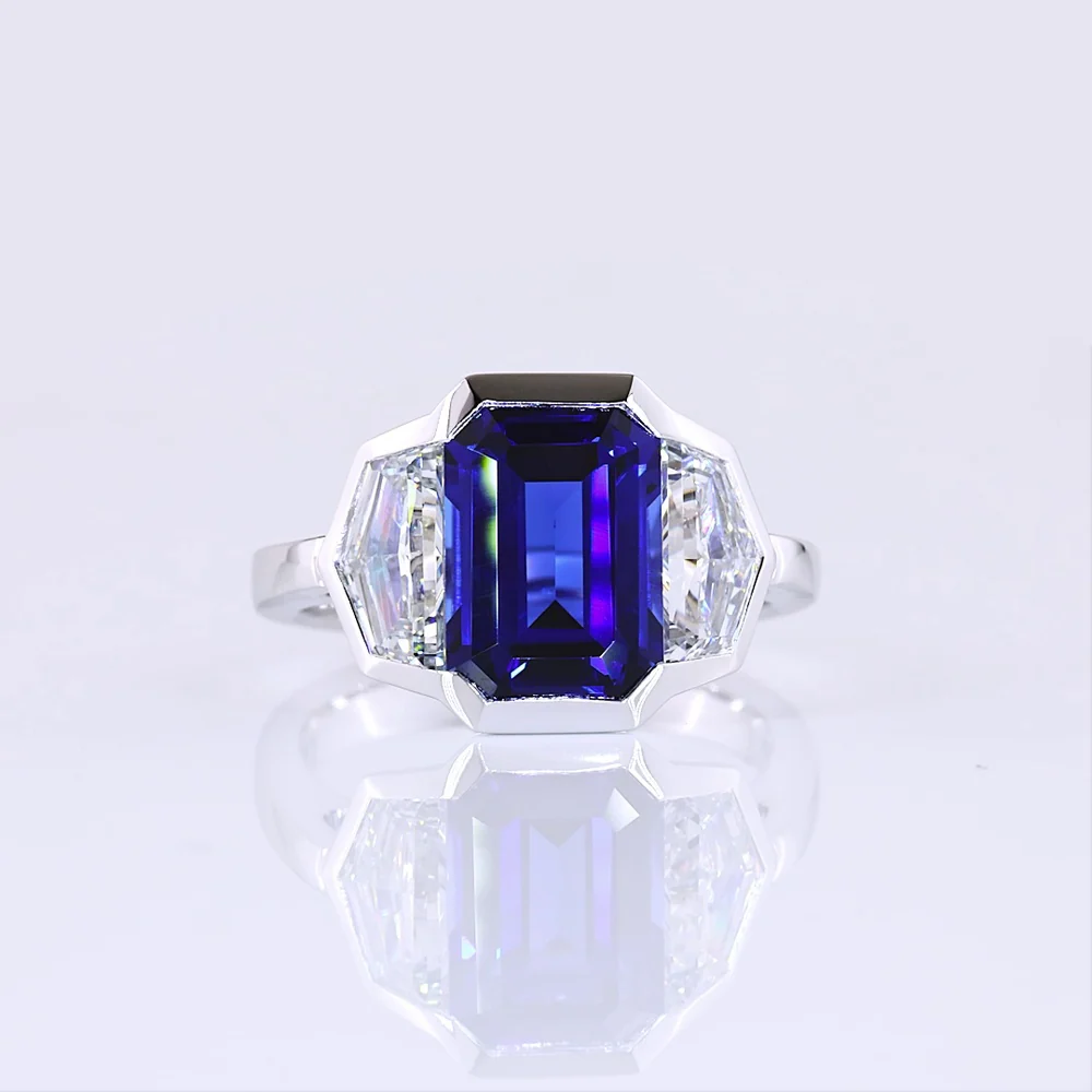 14K White Gold Emerald Cut Three-Stone Ring with 4.73 Carats Blue Lab Gemstone and 1.54 Carats Cadillac-Cut Lab Diamonds - 6.27 Carats Total Carat Weight - Covaloro Fine Jewelry