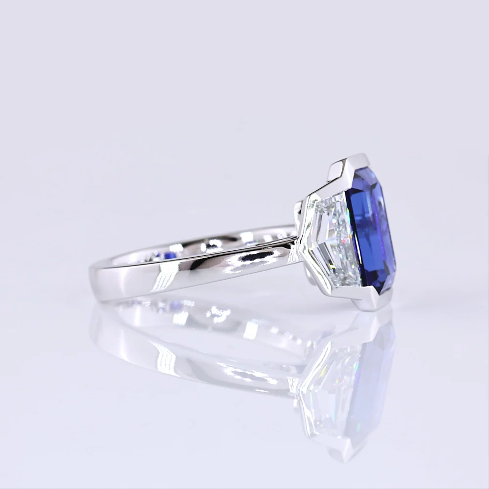 14K White Gold Emerald Cut Three-Stone Ring with 4.73 Carats Blue Lab Gemstone and 1.54 Carats Cadillac-Cut Lab Diamonds - 6.27 Carats Total Carat Weight - Covaloro Fine Jewelry - Image 2