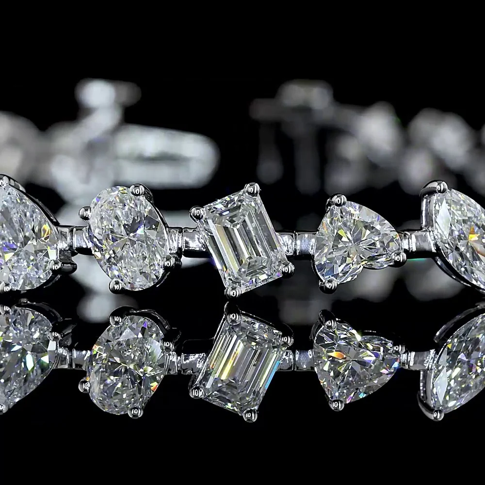 14K White Gold Mixed Shape Station Bracelet with 36 Lab Diamonds in Emerald, Oval, Pear, and Heart Cuts - 7.38 Carats Total Diamond Weight - Covaloro Fine Jewelry - Image 2