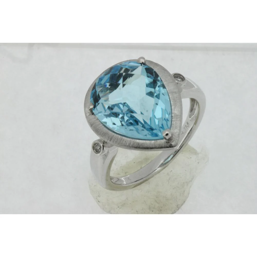 14K White Gold Pear-Shaped Blue Topaz Statement Ring with Brushed Bezel and Diamond Accents - 7.00 Carat Blue Topaz, 0.03 Carat Total Diamond Weight - Royal Jewelry