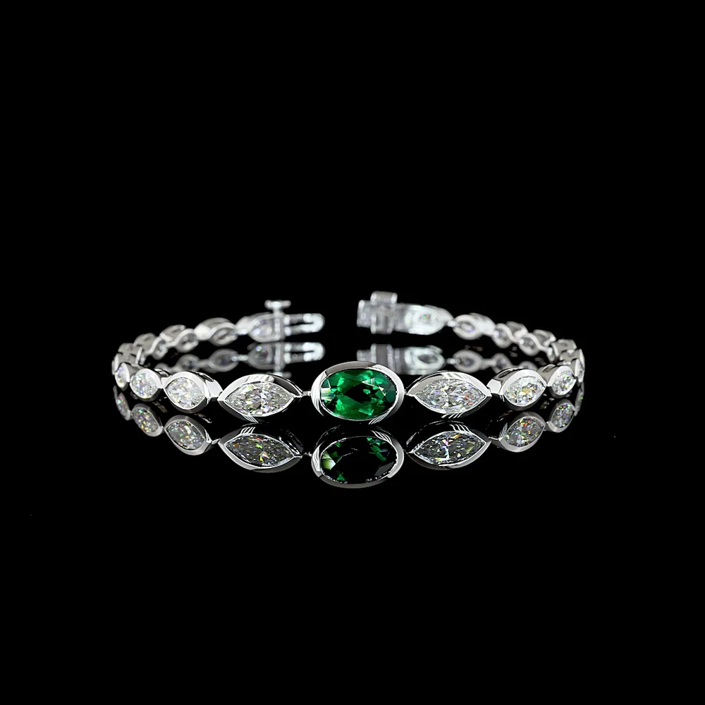 14K White Gold Riviera Bracelet with 1.83 Carats Oval Lab Emerald and Marquise Cut Lab Diamonds in Bezel Setting - 5.49 Total Carat Weight - Covaloro Fine Jewelry