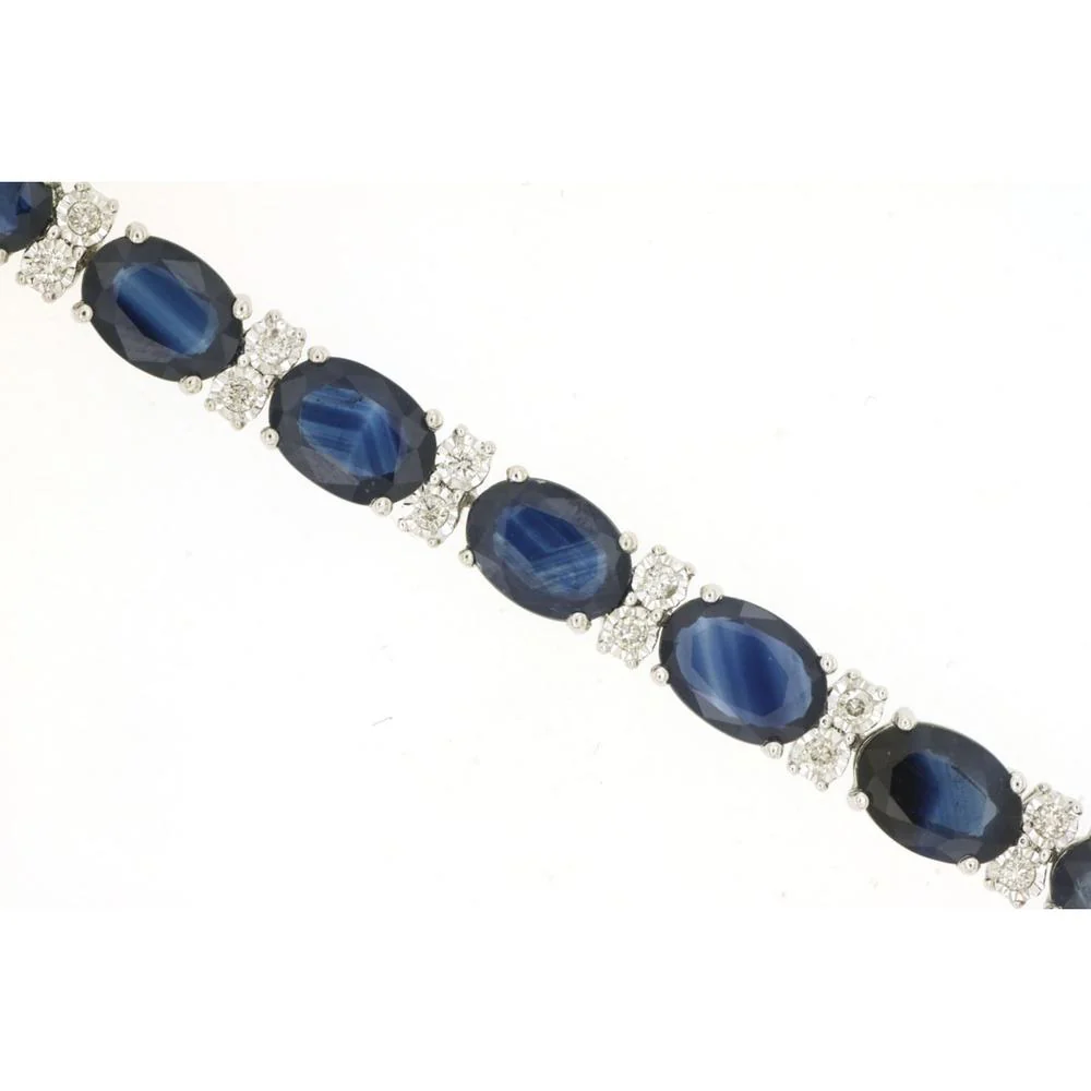 14K White Gold Tennis Bracelet with Oval Cut Sapphires and Diamond Accents - 20.00 Carat Total Sapphire Weight, 0.50 Carat Total Diamond Weight - Royal Jewelry