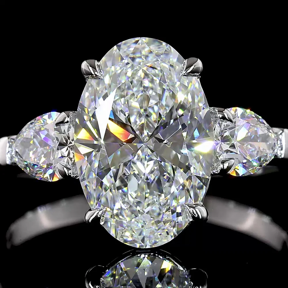 14K White Gold Three-Stone Ring with 2.69 Carat Oval Cut Lab Diamond and 0.66 Carat Pear Shaped Side Stones - IGI Certified E VVS2 - Covaloro Fine Jewelry - Image 2