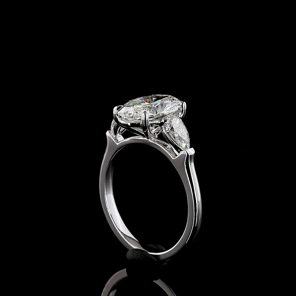 14K White Gold Three-Stone Ring with 2.69 Carat Oval Cut Lab Diamond and 0.66 Carat Pear Shaped Side Stones - IGI Certified E VVS2 - Covaloro Fine Jewelry - Image 3