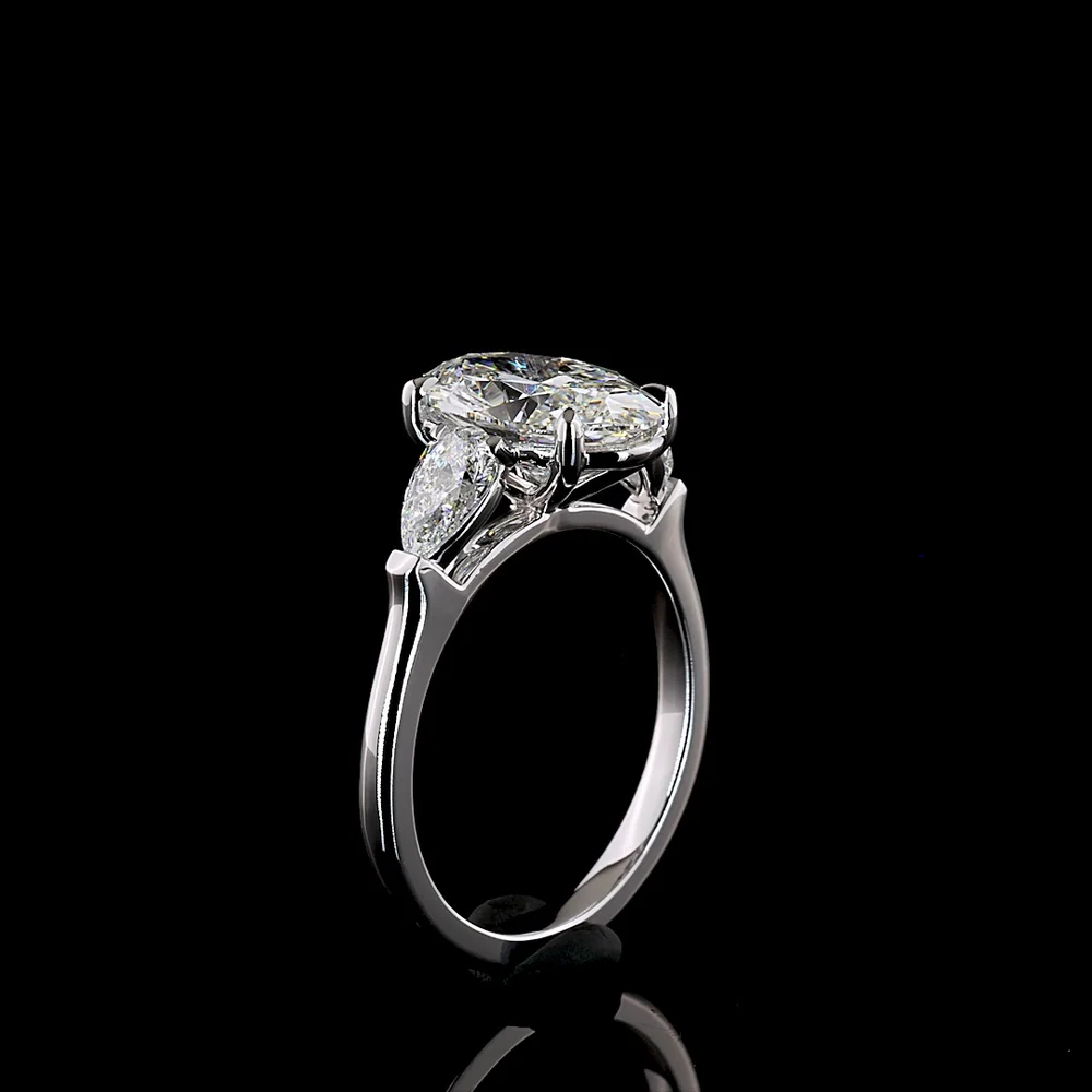 14K White Gold Three-Stone Ring with 2.69 Carat Oval Cut Lab Diamond and 0.66 Carat Pear Shaped Side Stones - IGI Certified E VVS2 - Covaloro Fine Jewelry - Image 4
