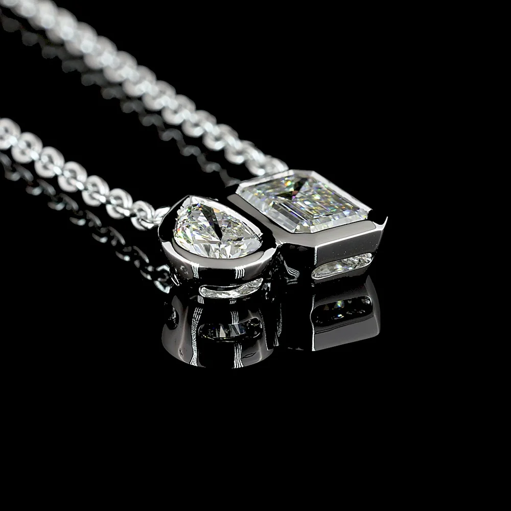 14K White Gold Toi et Moi Pendant with 1.10 Carat Emerald Cut and 0.48 Carat Pear Shape Lab Diamonds - 1.58 Carat Total Weight in Bezel Setting - Covaloro Fine Jewelry - Image 3