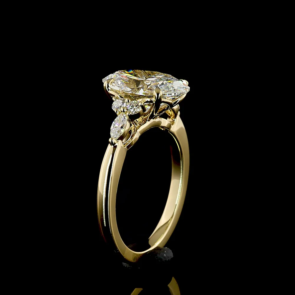 14K Yellow Gold 3.35 Carats Total Weight Oval Cut Lab Diamond Ring with E VVS2 Clarity and Marquise & Round Side Stones - IGI Certified - Covaloro Fine Jewelry - Image 4