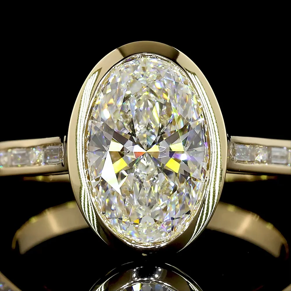 14K Yellow Gold Bezel Set Oval Cut Lab Diamond Solitaire Ring with Baguette and Round Diamond Shank - 3.43 Carat Total Diamond Weight - Covaloro Fine Jewelry - Image 2