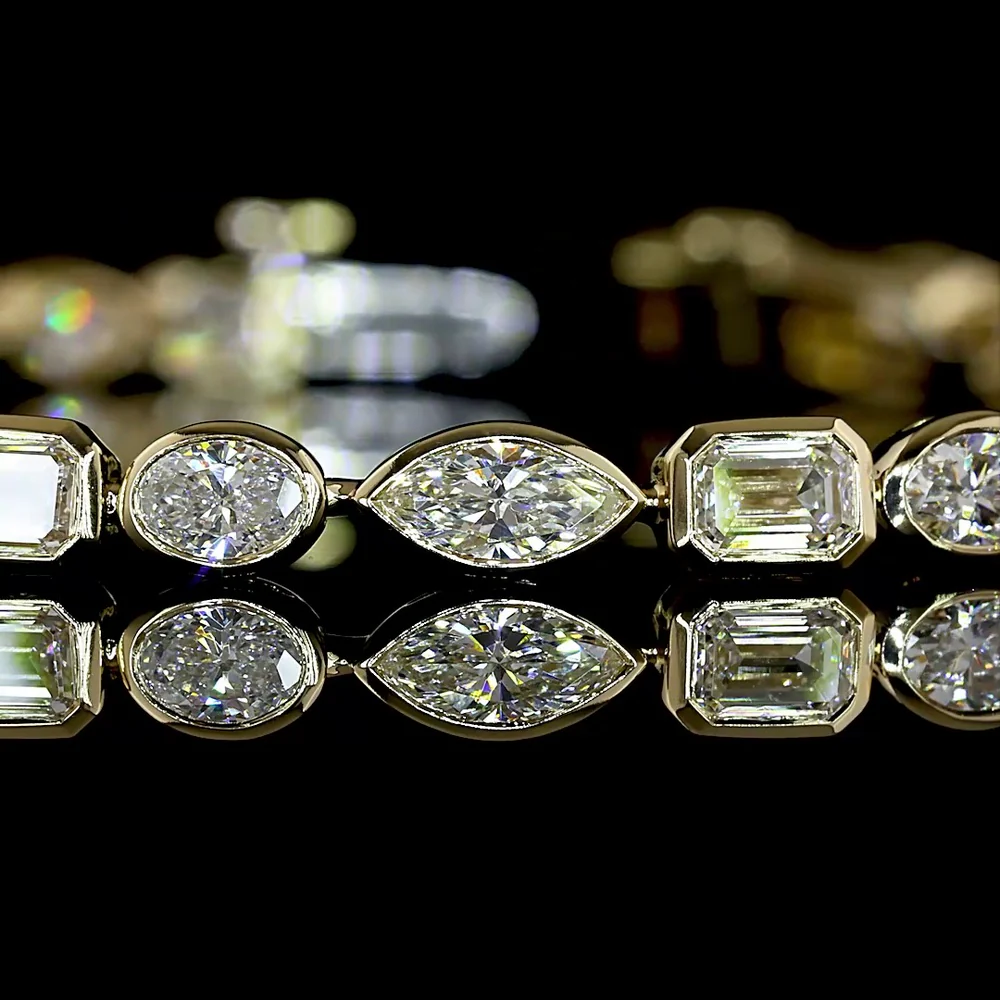 14K Yellow Gold East-West Bezel Set Mixed Shape Tennis Bracelet with 4.77 Carats Lab-Grown Emerald, Oval, and Marquise Diamonds - Covaloro Fine Jewelry - Image 2