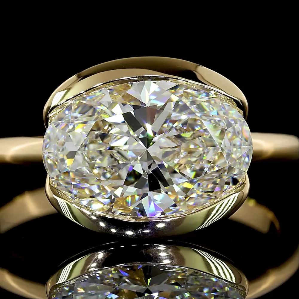 14K Yellow Gold East-West Oval Lab Diamond Solitaire Ring with Half-Bezel Setting - 2.57 Carat E VVS2 IGI Certified - Covaloro Fine Jewelry - Image 2