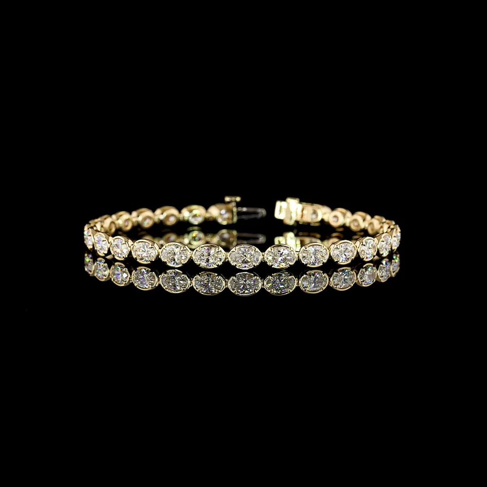 14K Yellow Gold East-West Tennis Bracelet with 28 Oval Cut Lab Diamonds - 7.65 Carats Total Diamond Weight, E-F Color VS1 Clarity, Bezel-Prong Setting - Covaloro Fine Jewelry