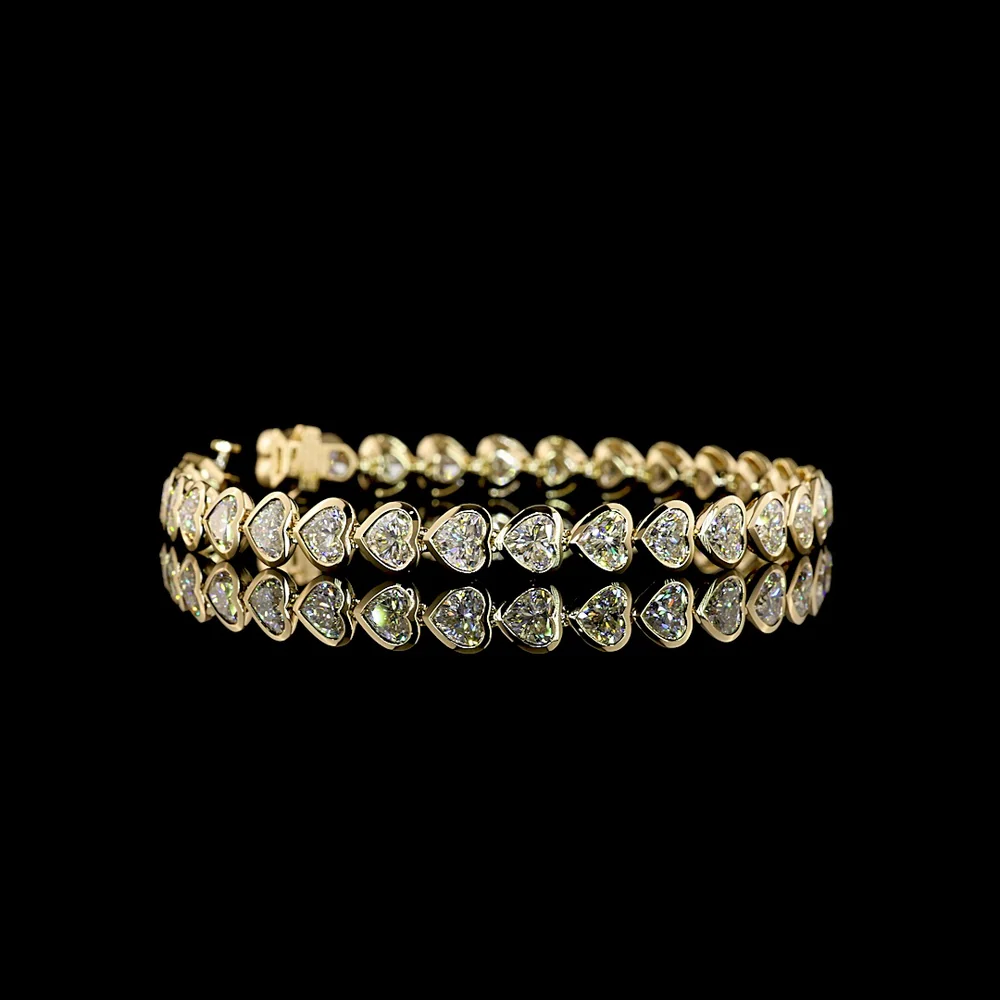 14K Yellow Gold Heart Shaped Lab Diamond Tennis Bracelet with East-West Bezel Setting - 13.04 Carat Total Weight - Covaloro Fine Jewelry