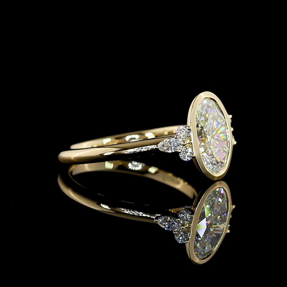 14K Yellow Gold Oval Cut Lab Diamond Ring with Bezel Setting and Marquise & Round Side Accents - 2.17 Carats Total Diamond Weight - Covaloro Fine Jewelry - Image 2