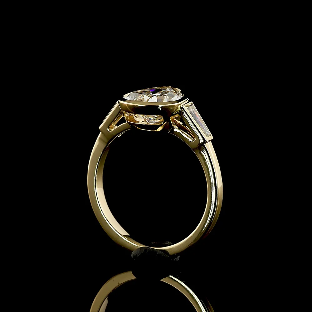 14K Yellow Gold Pear Shape Three Stone Ring with Bezel Set 2.52 Carat Lab Diamond and Tapered Baguette Side Stones - 2.93 Carat Total Diamond Weight - Covaloro Fine Jewelry - Image 3