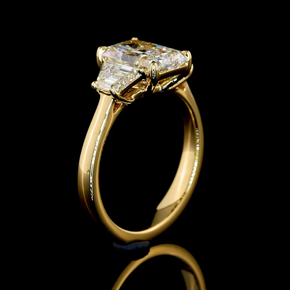 14K Yellow Gold Radiant Cut Three Stone Ring with 1.60 Carats D VVS2 Center Diamond and 0.63 Carats Trapezoid Side Stones - 2.23 Carats Total Diamond Weight - Covaloro Fine Jewelry - Image 4