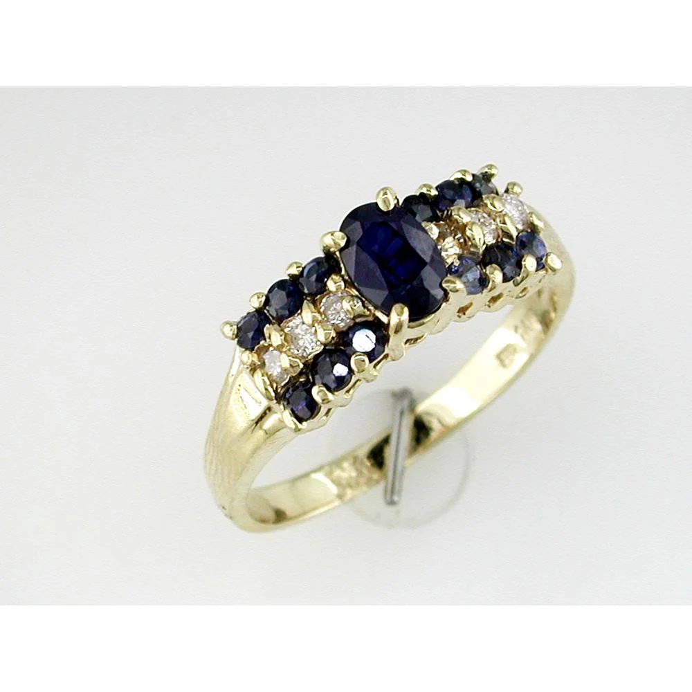 14K Yellow Gold Ring with Oval Sapphire and Round Sapphire & Diamond Accents - 1.20 Carat Sapphire and 0.16 Carat Diamond Weight - Royal Jewelry