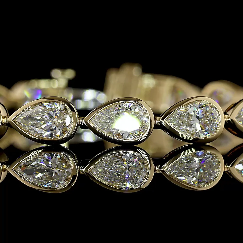 14K Yellow Gold Tennis Bracelet with East-West Bezel Set Pear Shaped Lab Diamonds - 10.98 Carat Total Weight (21 Stones, E-F Color, VS1 Clarity) - Covaloro Fine Jewelry - Image 2