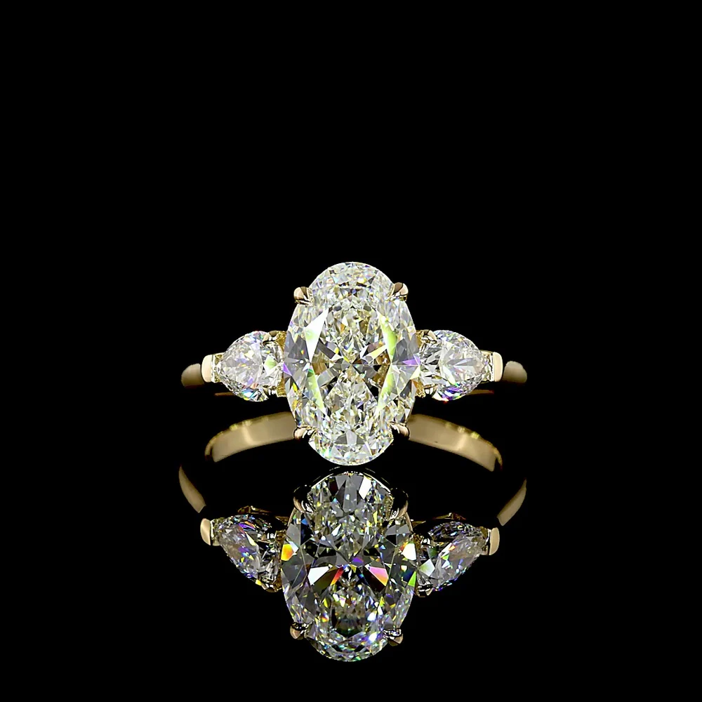 14K Yellow Gold Three Stone Ring with 2.20 Carat Oval Cut Lab Diamond and 0.60 Carat Pear Cut Lab Diamonds - 2.80 Carat Total Weight - Covaloro Fine Jewelry