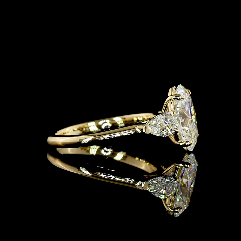 14K Yellow Gold Three Stone Ring with 2.20 Carat Oval Cut Lab Diamond and 0.60 Carat Pear Cut Lab Diamonds - 2.80 Carat Total Weight - Covaloro Fine Jewelry - Image 2