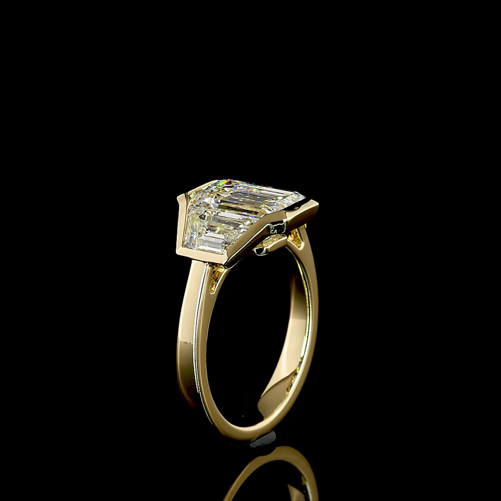 14K Yellow Gold Three Stone Ring with 3.00 Carat Emerald Cut Lab Diamond and 1.60 Carat Trapezoid Side Diamonds - 4.60 Carat Total Diamond Weight - Covaloro Fine Jewelry - Image 4