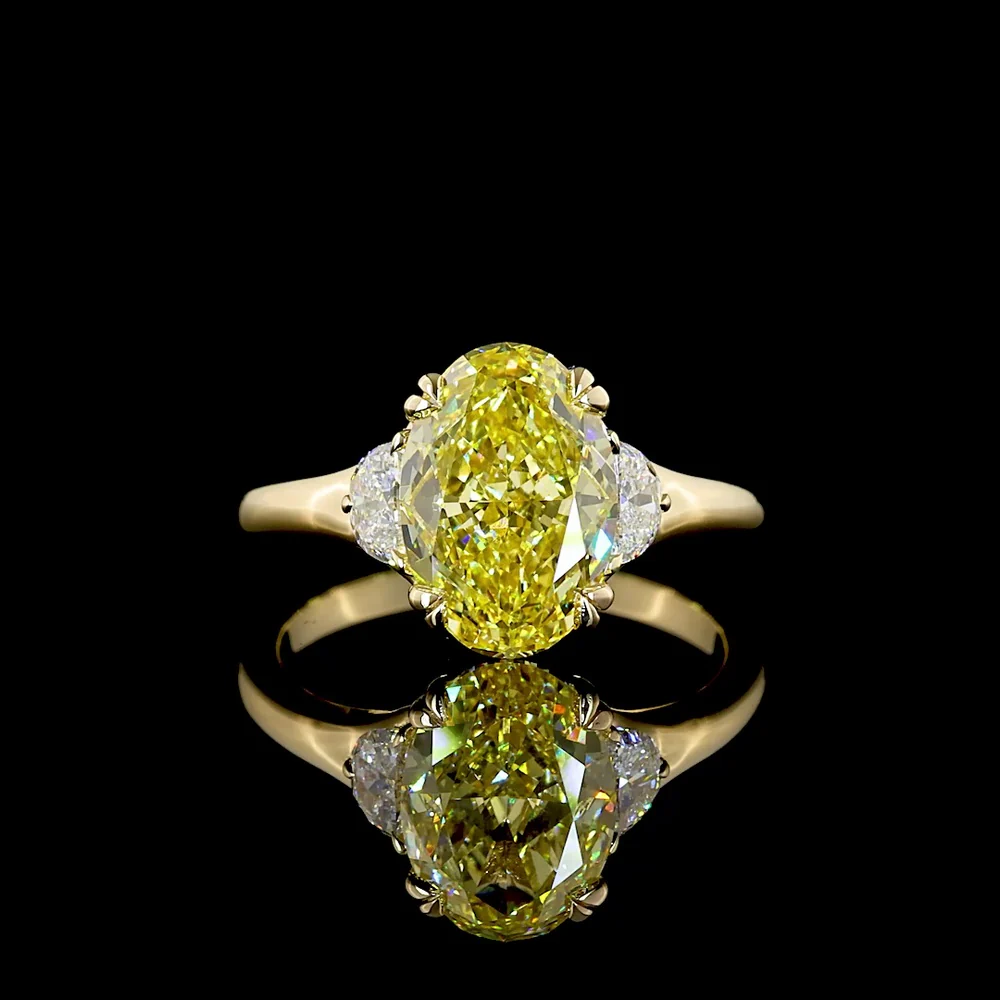 14K Yellow Gold Two-Tone Three Stone Ring with 3.02 Carat Oval Fancy Intense Yellow Lab Diamond and 0.30 Carat Half-Moon Side Stones - Total Carat Weight 3.32 - Covaloro Fine Jewelry