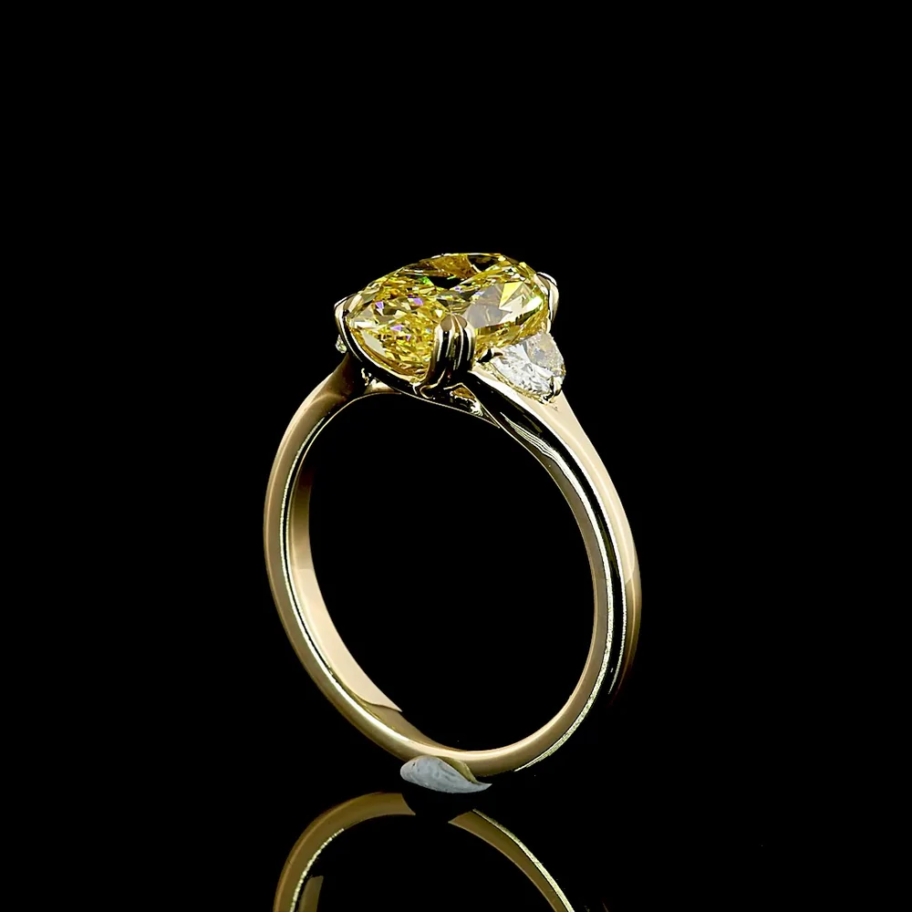 14K Yellow Gold Two-Tone Three Stone Ring with 3.02 Carat Oval Fancy Intense Yellow Lab Diamond and 0.30 Carat Half-Moon Side Stones - Total Carat Weight 3.32 - Covaloro Fine Jewelry - Image 3