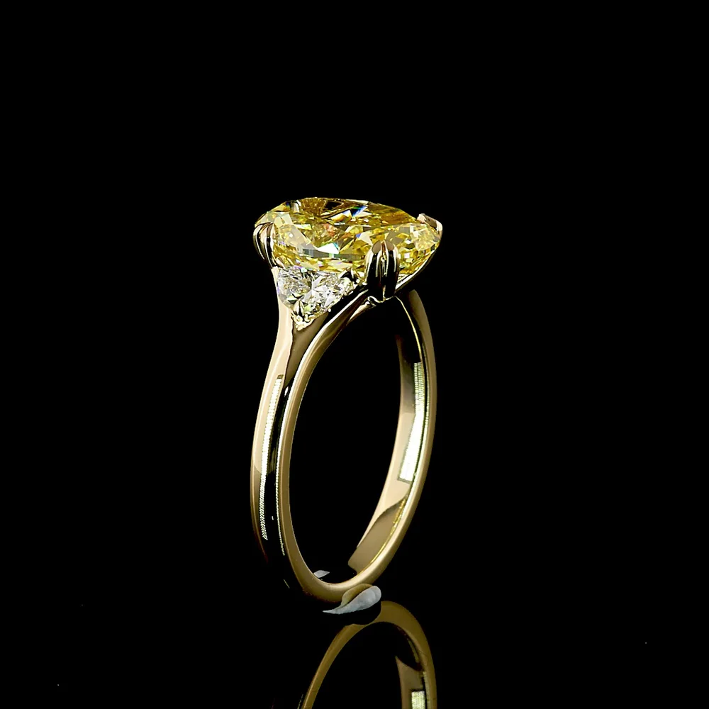 14K Yellow Gold Two-Tone Three Stone Ring with 3.02 Carat Oval Fancy Intense Yellow Lab Diamond and 0.30 Carat Half-Moon Side Stones - Total Carat Weight 3.32 - Covaloro Fine Jewelry - Image 4