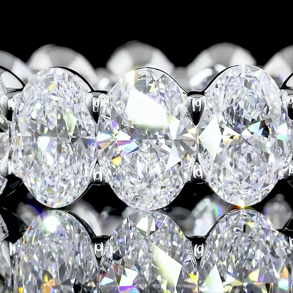 18K White Gold Eternity Band with North-South Prong Set Oval Cut Lab Diamonds - 7.51 Total Carat Weight, E-F Color, VS Clarity - Covaloro Fine Jewelry - Image 3