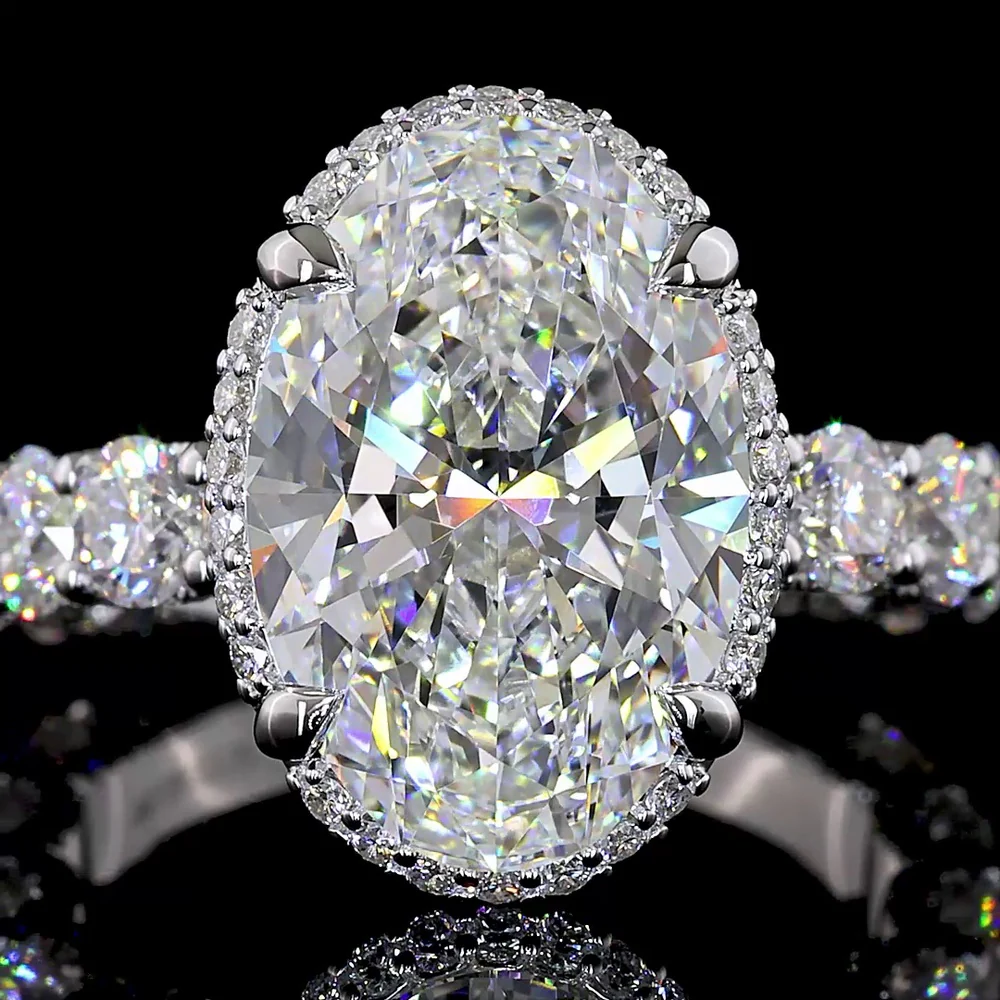 18K White Gold Hidden Halo Ring with 5.01 Carat Oval Cut E VVS2 Lab Diamond and 2.58 Carat Brilliant Round Accent Diamonds - Total 7.59 Carats - Covaloro Fine Jewelry - Image 2