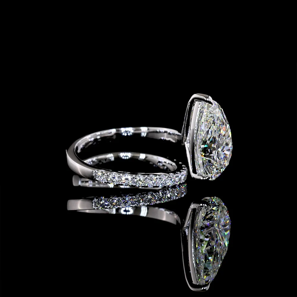 18K White Gold Pear Shape Solitaire Diamond Shank Ring with Inclined Center and Accent Stones - 5.49 Carats Total Diamond Weight (5.04 Carats Center F VS1, 0.45 Carats Side E VS1) - Covaloro Fine Jewelry - Image 2