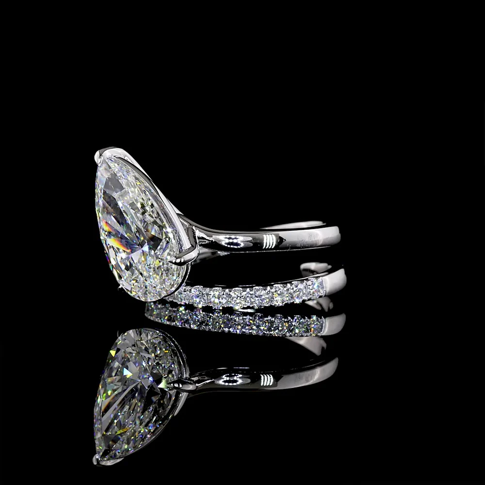 18K White Gold Pear Shape Solitaire Diamond Shank Ring with Inclined Center and Accent Stones - 5.49 Carats Total Diamond Weight (5.04 Carats Center F VS1, 0.45 Carats Side E VS1) - Covaloro Fine Jewelry - Image 3