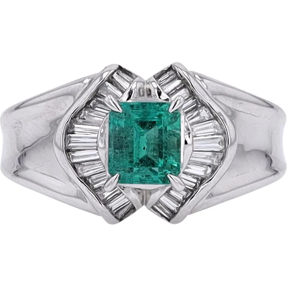 Platinum 0.85 Carat Emerald Ring with 0.33 Carat Baguette Diamond Halo