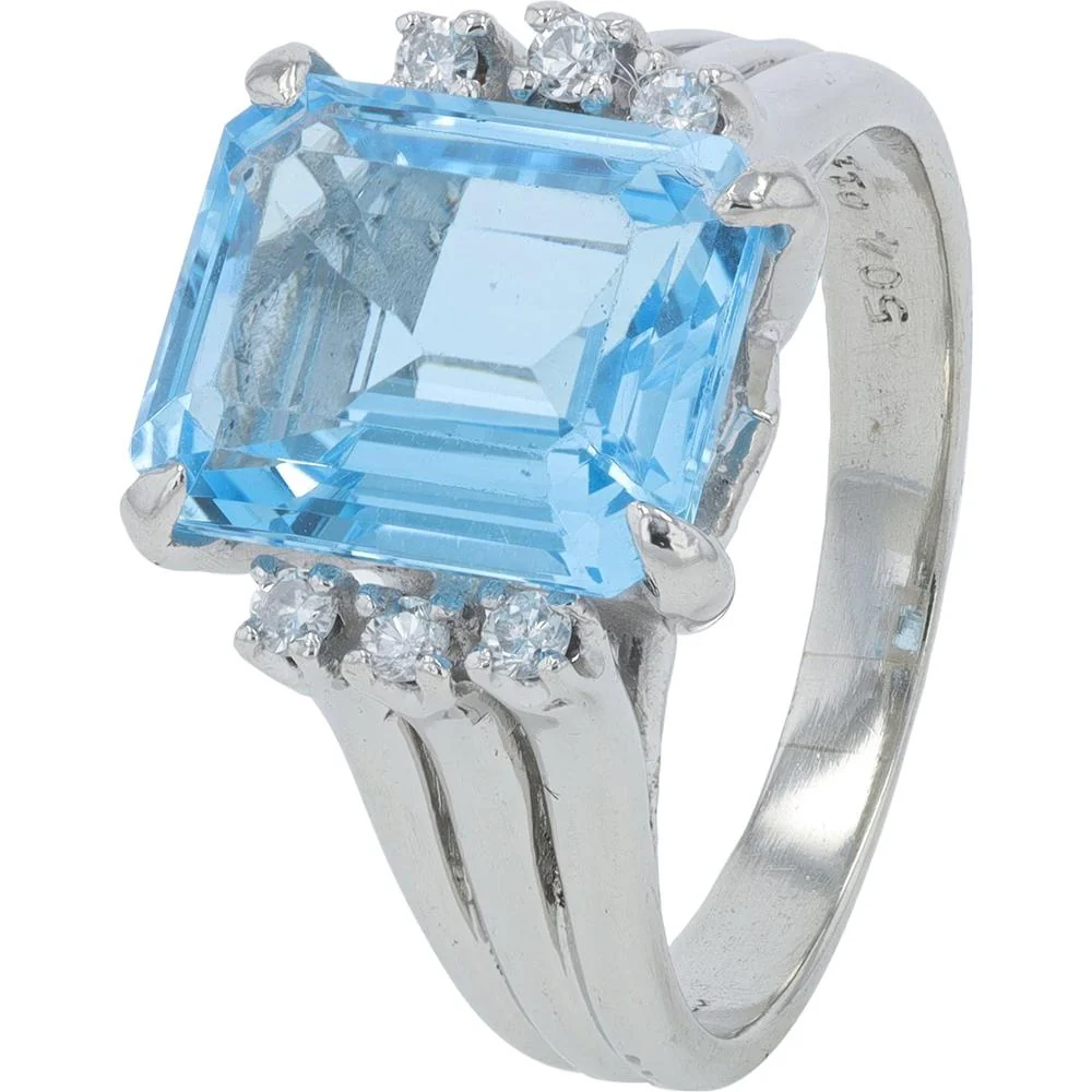 Platinum 16.03 Carat Emerald - Cut Blue Topaz Ring with 0.12 Carat Accent Diamonds