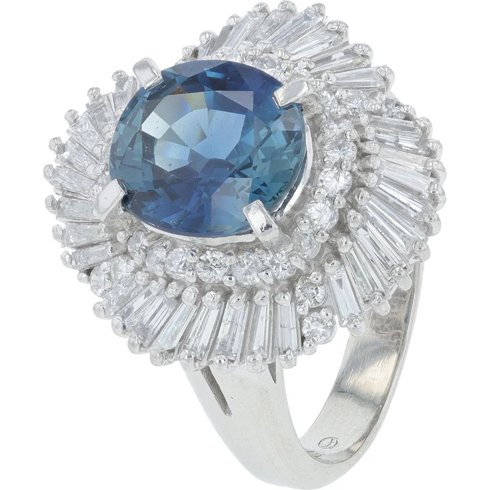 Platinum 3.25 Carat Oval Sapphire Ring with 0.49 Carat Baguette and Round Diamond Halo