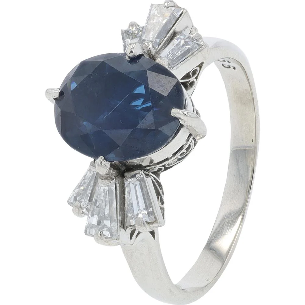 Platinum 3.25 Carat Total Weight Oval Sapphire Ring with 0.56 Carat Tapered Baguette Diamonds