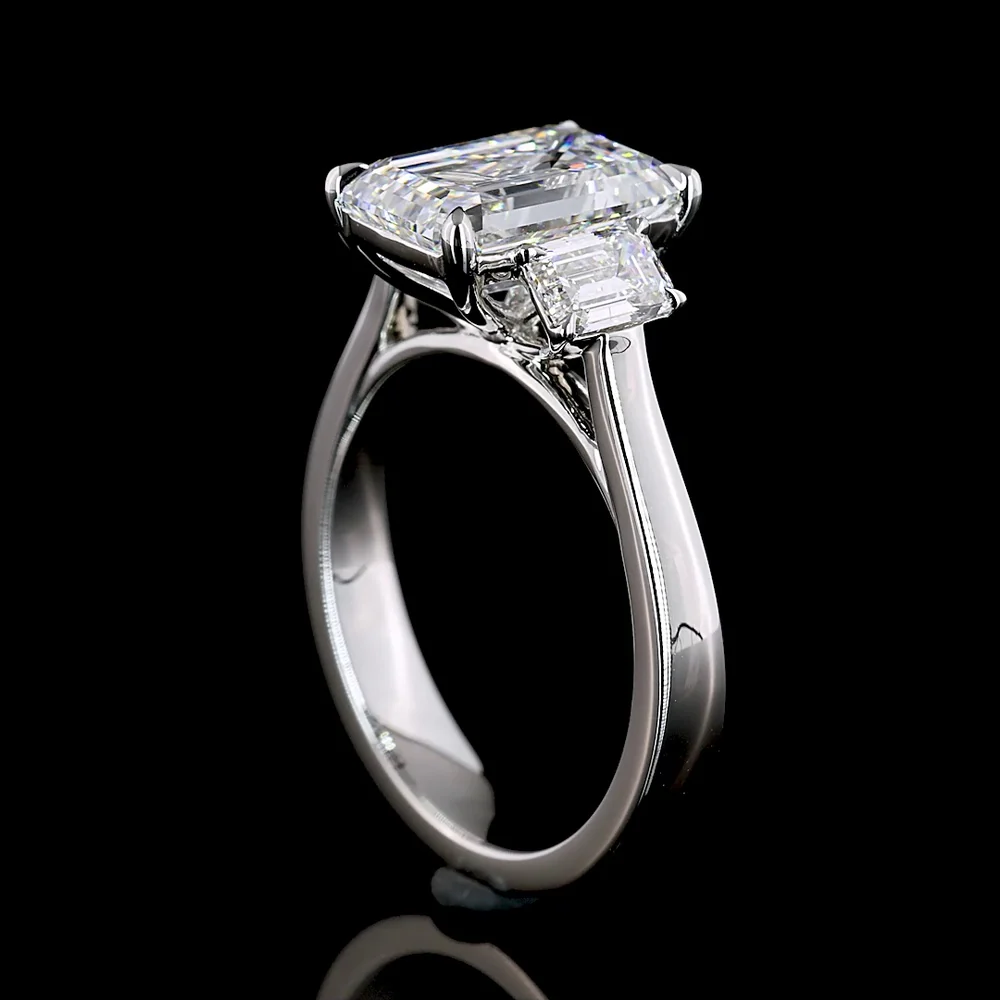 Platinum 3 Stone Ring with 3.01 Carat Emerald Cut Lab Diamond and 0.84 Carat Trapezoid Lab Diamonds - 3.85 Carat Total Weight - Covaloro Fine Jewelry - Image 2