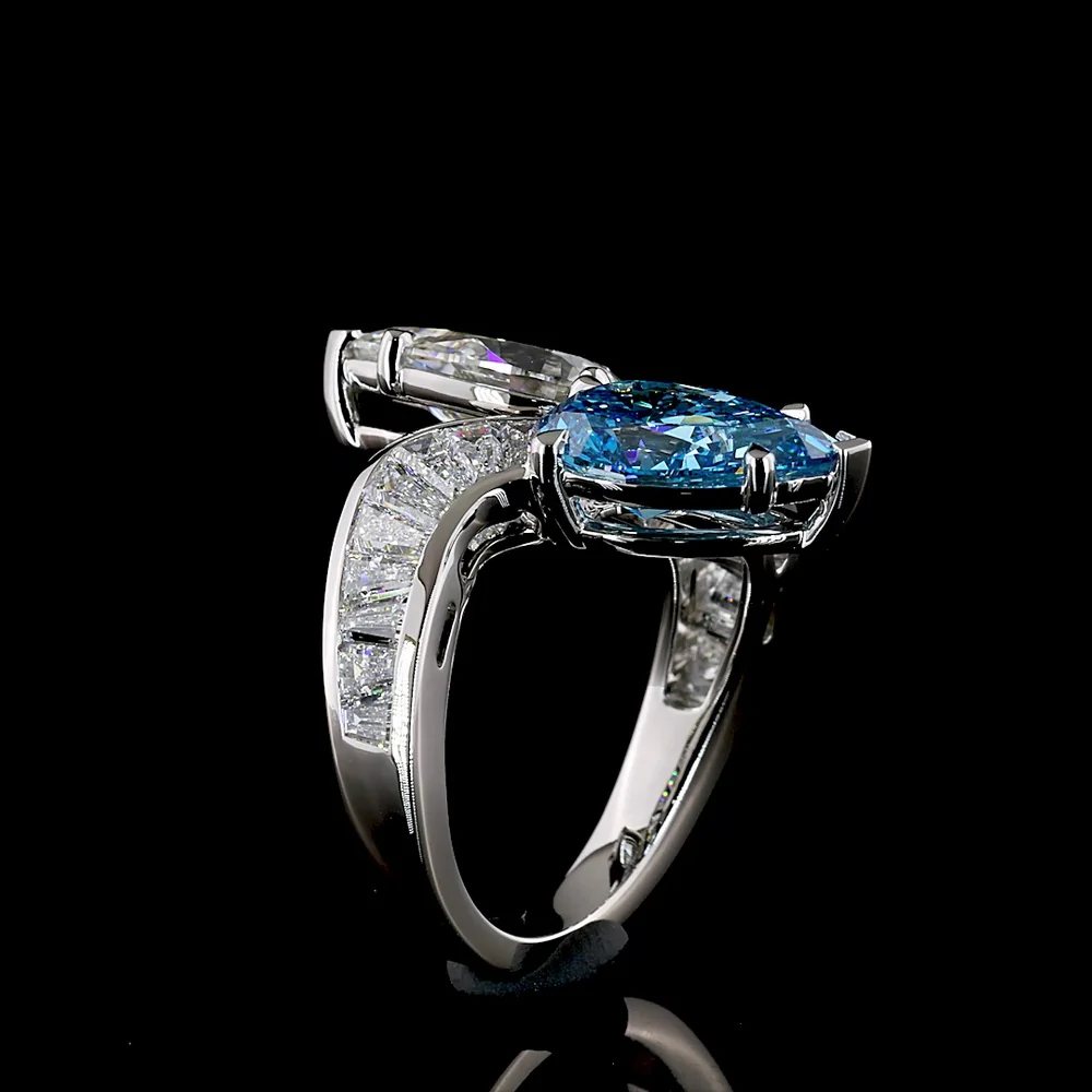 Platinum Toi et Moi Ring with Pear Shape Fancy Vivid Blue and White Lab Diamonds - 2.66 Carats Blue Diamond, 2.77 Carats White Diamond, Plus Baguette Accents - 7.09 Total Carat Weight - Covaloro Fine Jewelry - Image 4