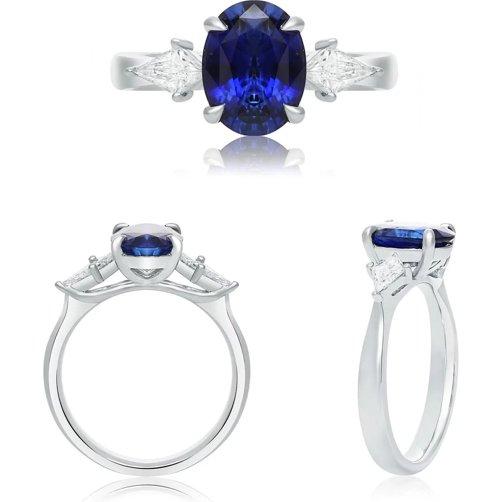 Roman & Jules - Platinum Three-Stone Ring with 2.10 Carat Oval Blue Sapphire and Trillion Diamond Accents